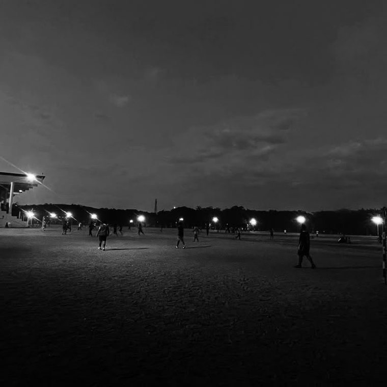 Floodlit ground after dark